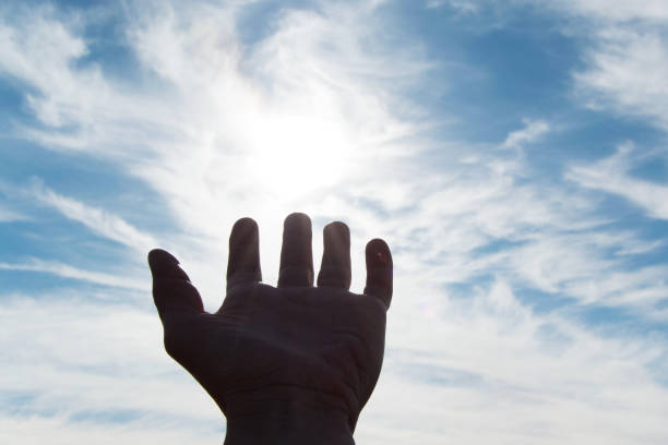 istock Human hand pointing to the sky, concept - faith, hope, seeking help 917750962