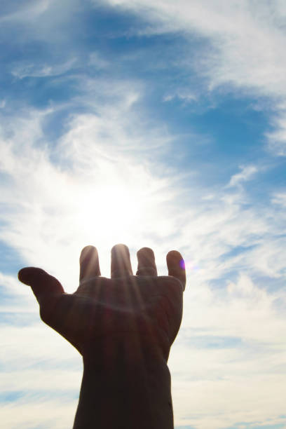 istock Human hand pointing to the sky, concept - faith, hope, seeking help 917750968