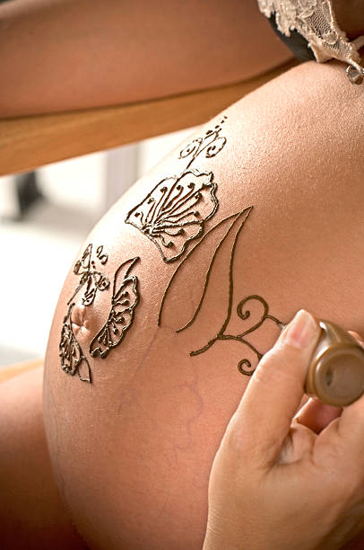 istock Henna tattoo on pregnant belly [n] 91775189