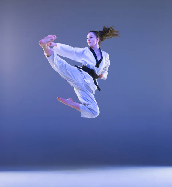 istock The karate girl with black belt 917759074