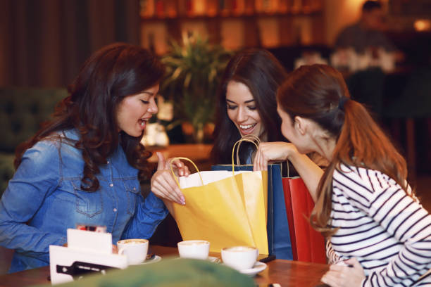 istock Three young women in a cafe after a shopping 917762718