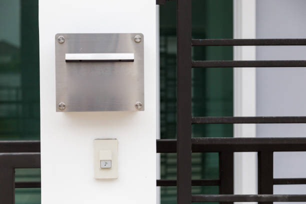 istock Ringing bell alarm and mail box  in front of house. 917763414