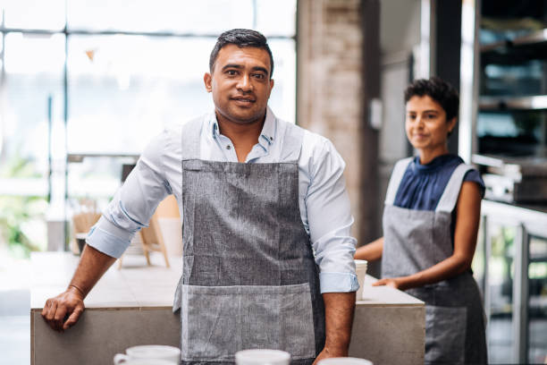 istock Two baristas working in modern urban bar 917763552