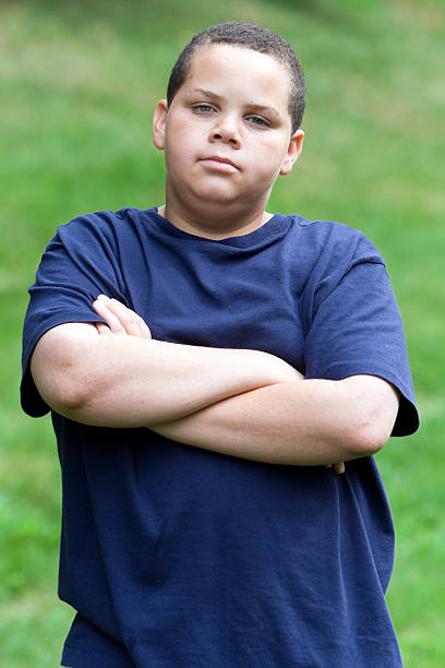 Annoyed teen  overweight boy stock pictures, royalty-free photos & images