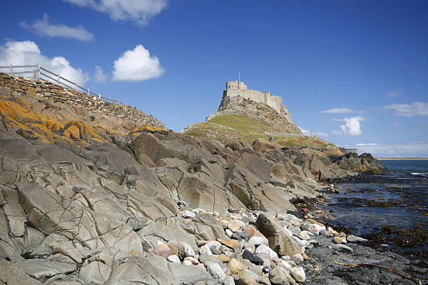 istock Holy Island Castle with rocks 91776512