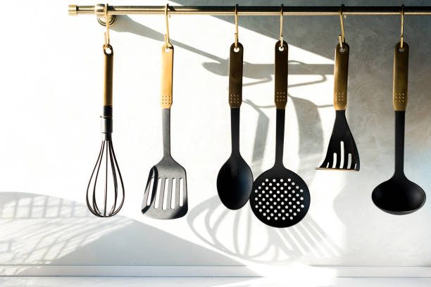 istock close-up view of various utensils hanging in kitchen 917770448