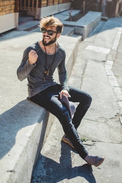 istock Hipster cheerfully holding fist and celebrate 917770780