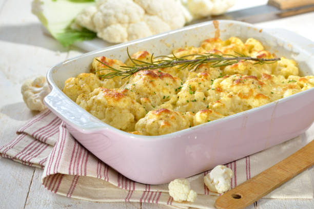 Hearty cauliflower gratin in a pink baking dish