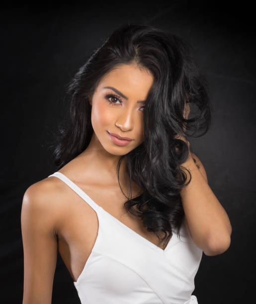 istock Beautiful woman's face with long dark hair 917777398