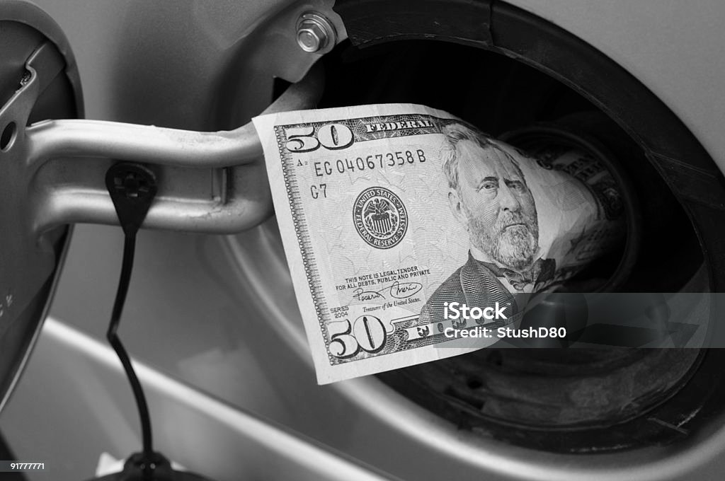 Money Down the Tank-Top - Lizenzfrei Benzin Stock-Foto