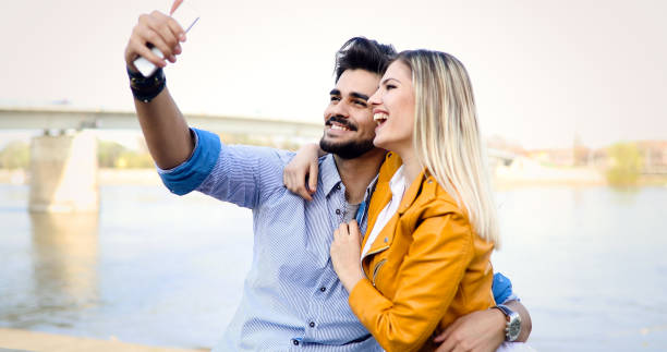 istock Couple in love taking selfies while traveling 917778316