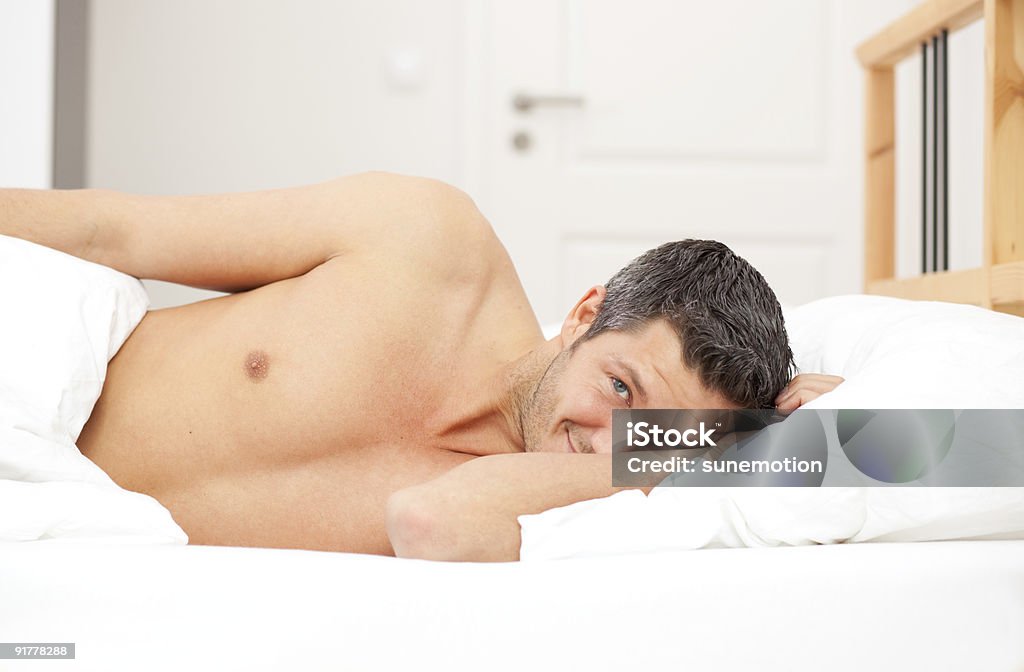 man in bed  Adult Stock Photo