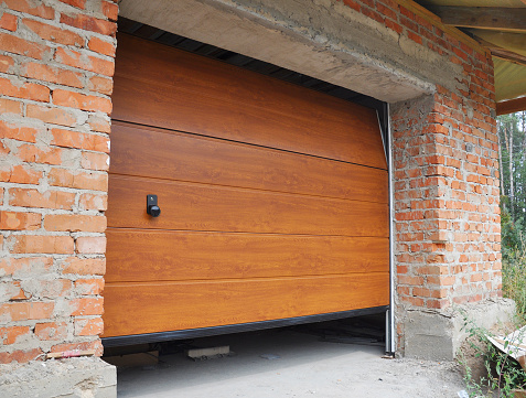 KYIV, UKRAINE - September 02, 2014: Install New House Garage Door.  Garage Door Installation.