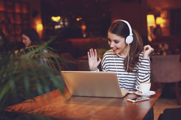 istock Young woman making video call in cafe 917786186