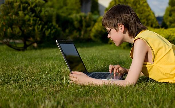 istock Boy and laptop in nature 91778645
