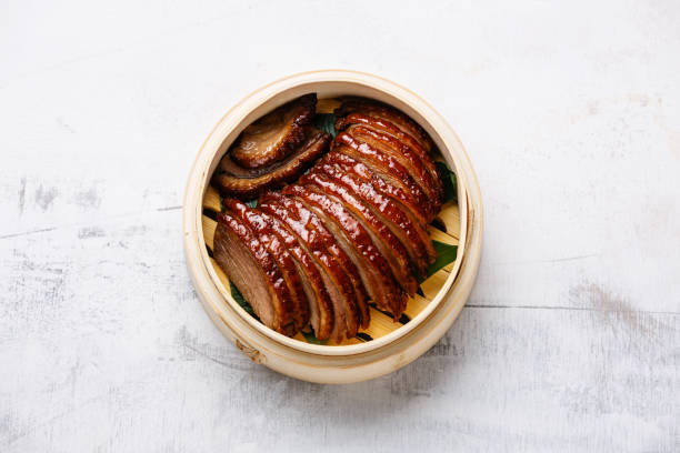 istock Sliced Peking Duck in bamboo steamer 917786532