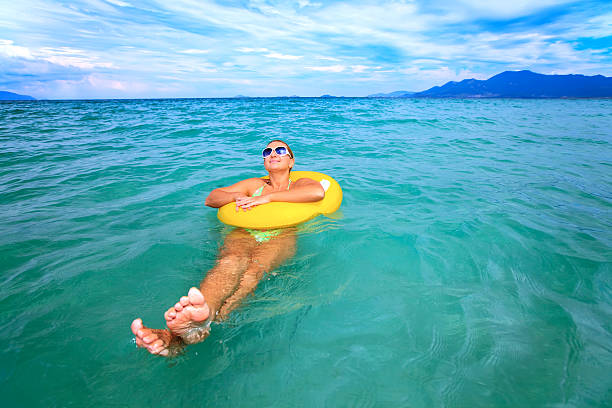 istock Woman with yellow tube 91778764