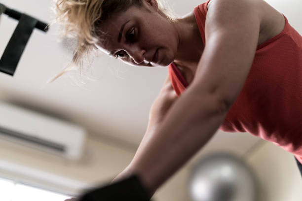 istock Young attractive woman doing exercises, indoor concept 917799044