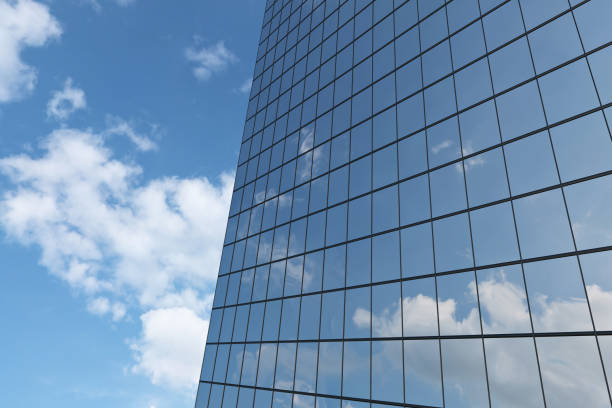 istock Wall of skyscraper under blue sky with clouds 917800490