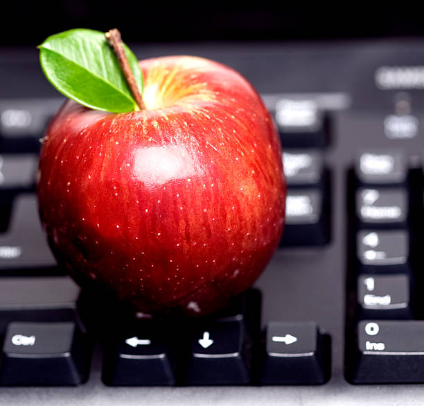istock Red apple on black keyboard with green leaf 91780261