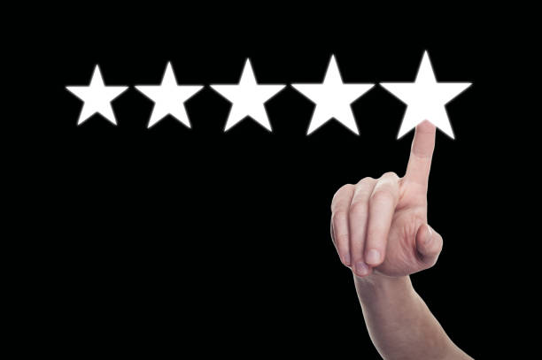 istock Quality Concept with Pointing Hand. Five Stars on Black Background 917806790