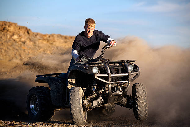 istock teenager riding quad 91780732