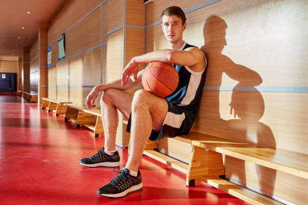 istock Serious confident young player with ball on training court 917812766