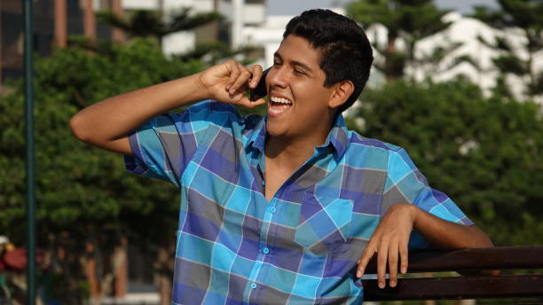 istock Happy Teen Boy Talking On Cell Phone 917814268