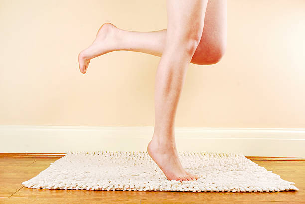 Woman's naked legs stock photo