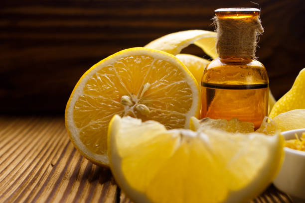 istock Lemon essential oil on a wooden background 917818304
