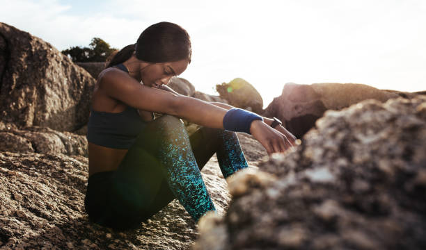 istock Female athlete taking rest after fitness training 917821378