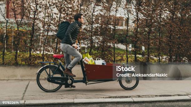 Delivery Boy On A Cargo Bike Stock Photo - Download Image Now - Cargo Bike, Bicycle, Shopping