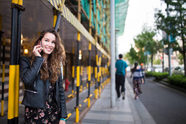 istock Smiling woman talking on mobile phone 917826946