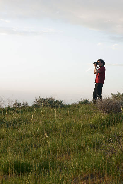 Man Photographing Sunset Standing stock photo