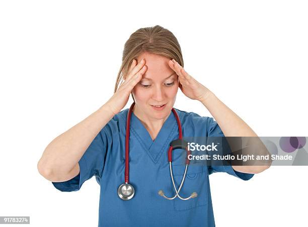 Preoccupied And Tired Young Nurse Stock Photo - Download Image Now - Busy, Nurse, 20-29 Years