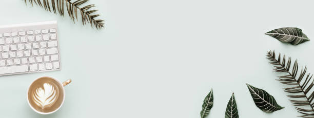 istock Flat Lay Banner, Simple Trendy Office Desk with keyboard and botanical elements. Minimal Modern Hipster Composition 917834018