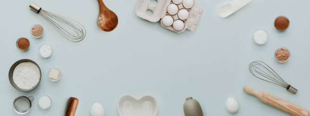 istock baking background with bake ingredients, banner for website on pastel background, top view, flat lay, copy space. Preparation Baking Kitchen Table Ware 917834028
