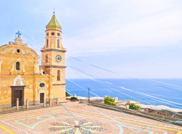 church by sea decorated with ribbons beautiful old church of San Gennaro decorated with colorful ribbons for Easter overlooking sea on sunny day in Praiano, Amalfi, Italy praiano photos stock pictures, royalty-free photos & images
