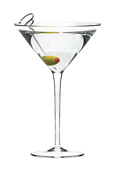 A dry martini with a green olive Martini with olive on fancy skewer, isolated on white. Includes pro clipping path. martini stock pictures, royalty-free photos & images