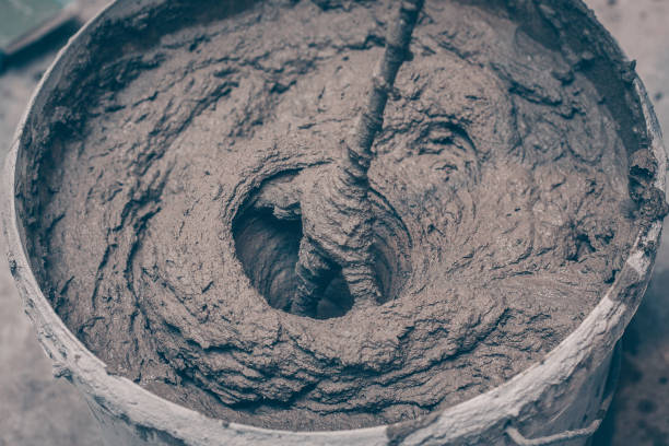 istock The plaster in the bucket is kneaded with a mixer 917845084