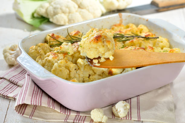 istock Hearty cauliflower gratin in a pink baking dish 917846468