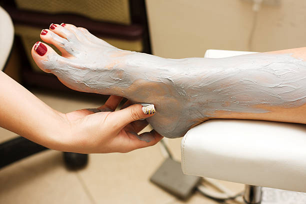 Feet treatment  people covered in mud stock pictures, royalty-free photos & images