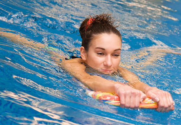 istock young girl is swimming 91785266