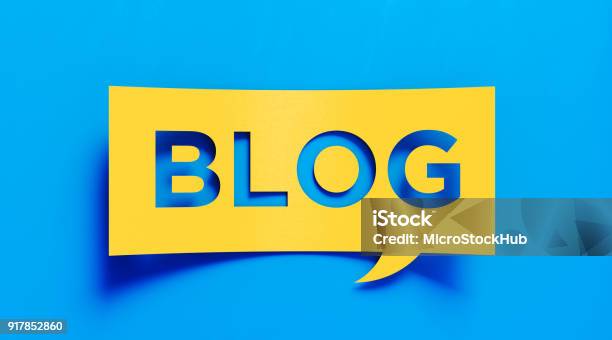 Blogging Concept Yellow Blog Text Over Blue Background Stock Photo - Download Image Now