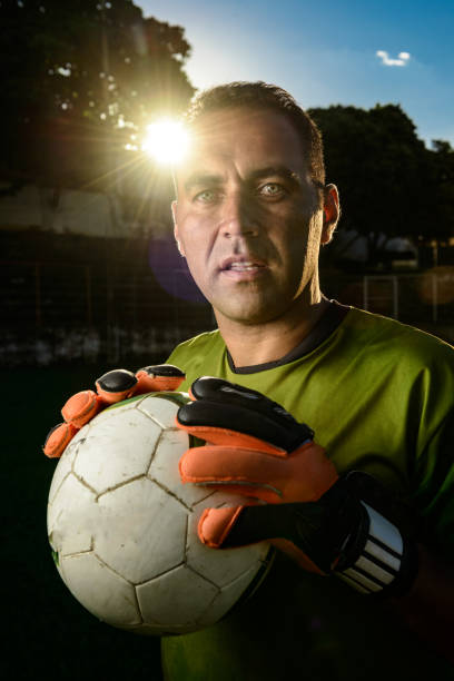 istock Goalkeeper holding a soccer ball 917853256