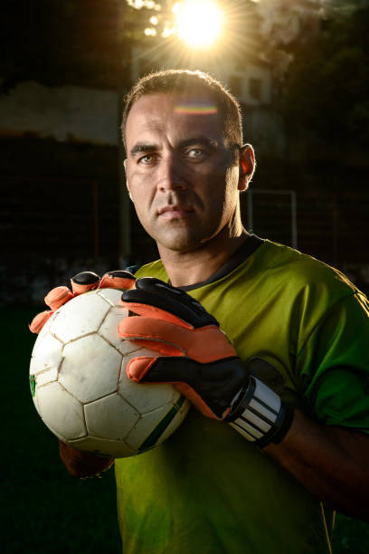 istock Goalkeeper holding a soccer ball 917853262