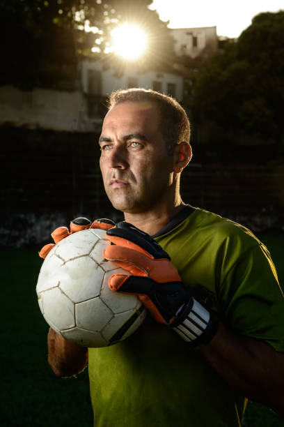 istock Goalkeeper holding a soccer ball 917853266