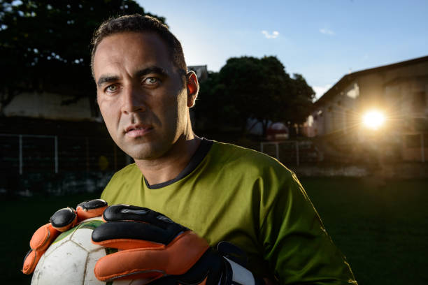 istock Goalkeeper holding a soccer ball 917853270