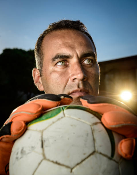 istock Goalkeeper holding a soccer ball 917853272