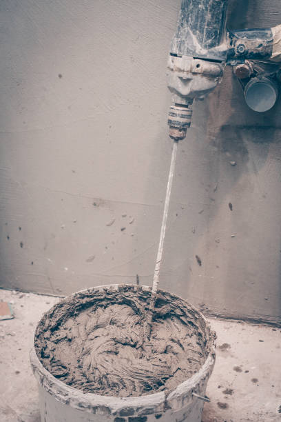 istock Mixer in a bucket with finished plaster, construction tools for finishing works 917853332